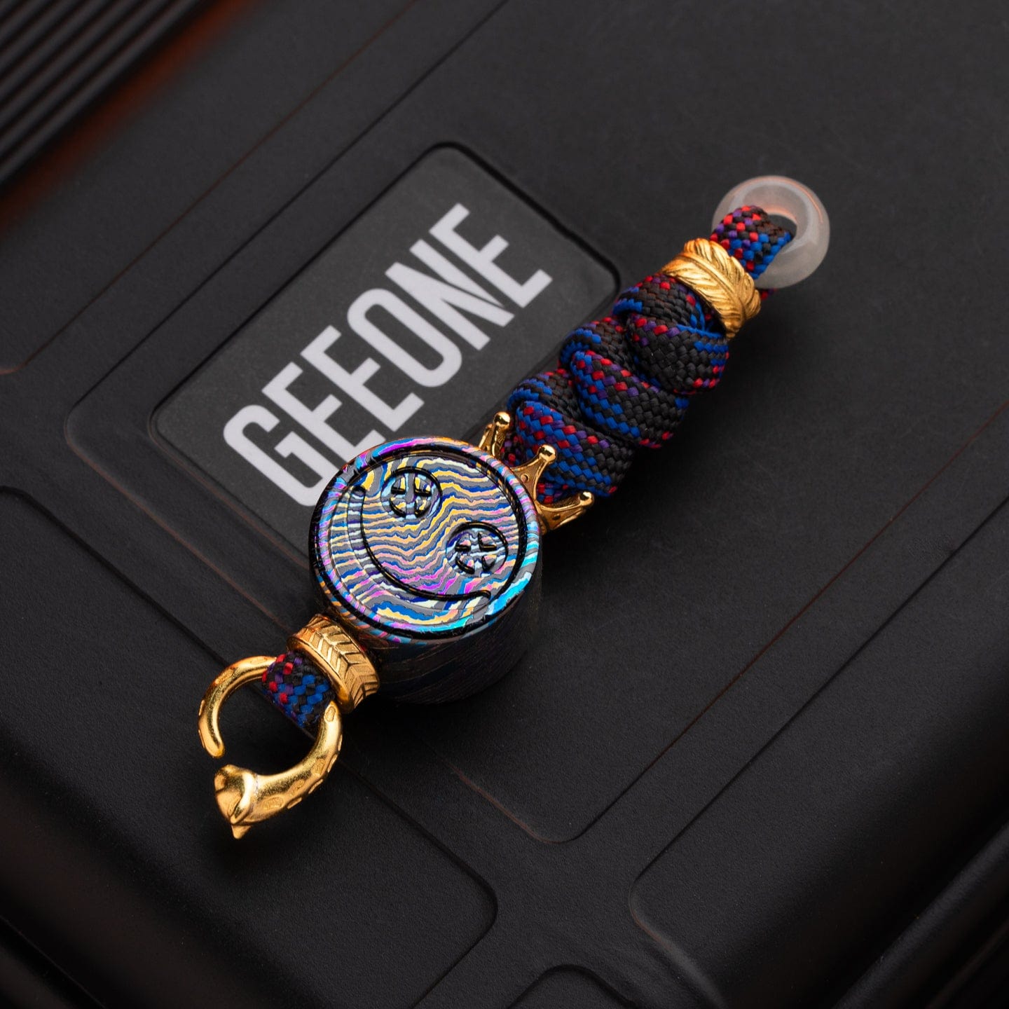 EDC Lanyard Bead – Bad Guy Smile | Titanium Zirconium Damascus Mokuti Super Conductor