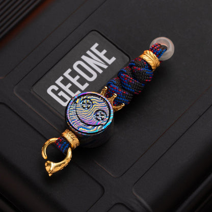 EDC Lanyard Bead – Bad Guy Smile | Titanium Zirconium Damascus Mokuti Super Conductor