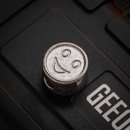 EDC Lanyard Bead – Bad Guy Smile | Titanium Zirconium Damascus Mokuti Super Conductor