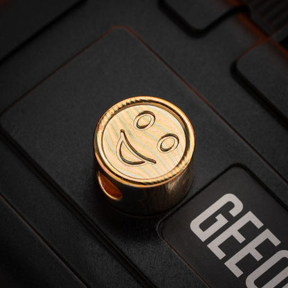 EDC Lanyard Bead – Bad Guy Smile | Titanium Zirconium Damascus Mokuti Super Conductor