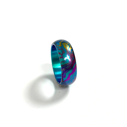 Anodized Titanium Band Ring: blue pink and purple patterned ring on white (gallery view 10).
