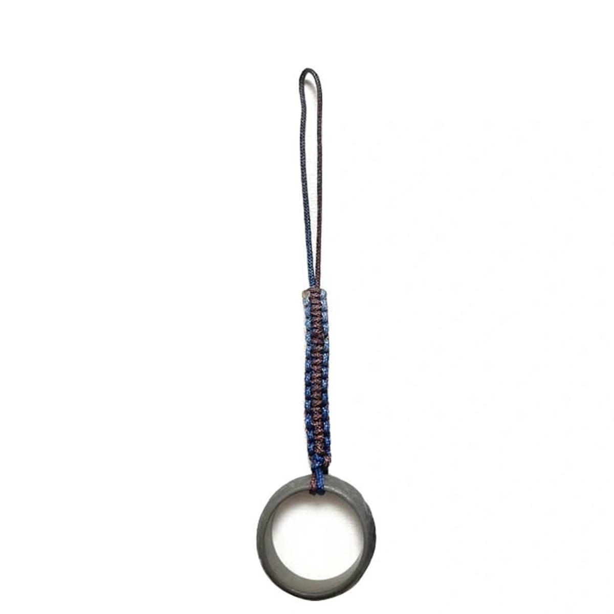 Anodized Titanium Band Ring: dark patterned ring on a blue woven cord loop (gallery view 17).