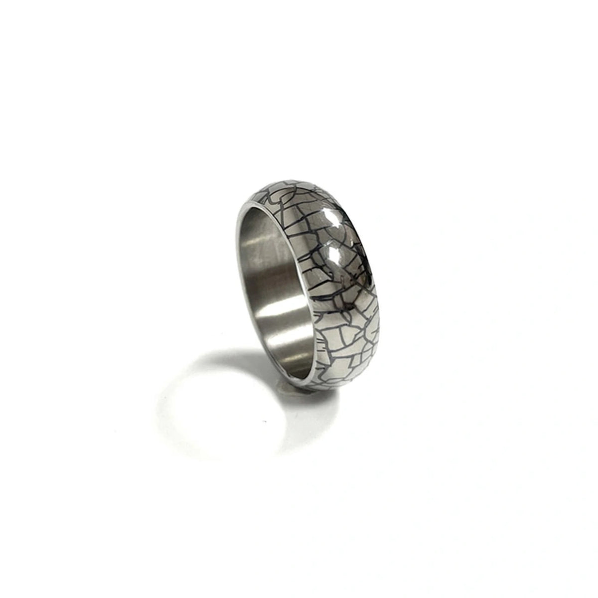 Anodized Titanium Band Ring: silver dark crackle patterned ring on white (gallery view 12).