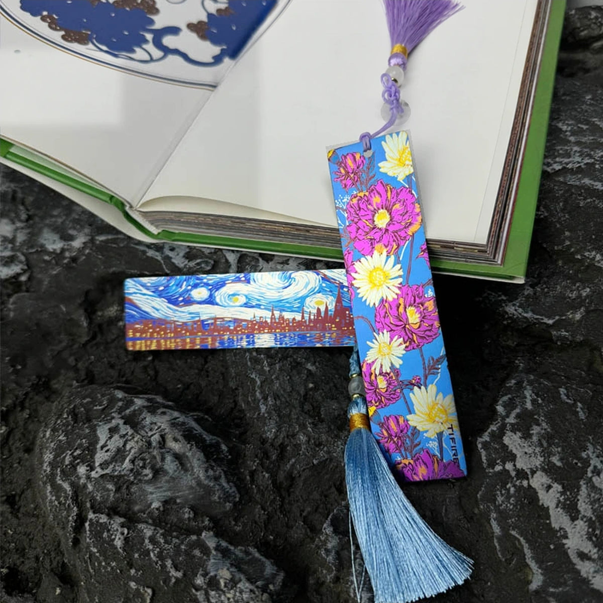 Titanium Tassel Bookmark: floral bookmark with purple tassel beside an open book (gallery view 04).