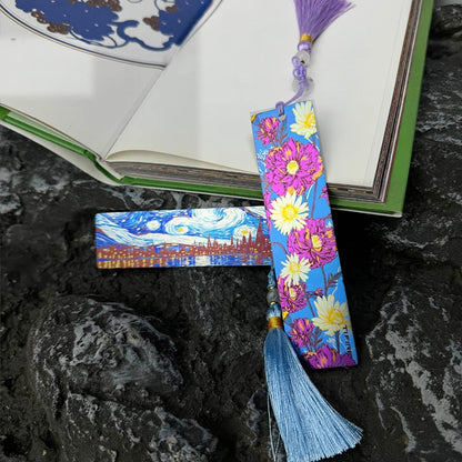 Titanium Tassel Bookmark: floral bookmark with purple tassel beside an open book (gallery view 04).
