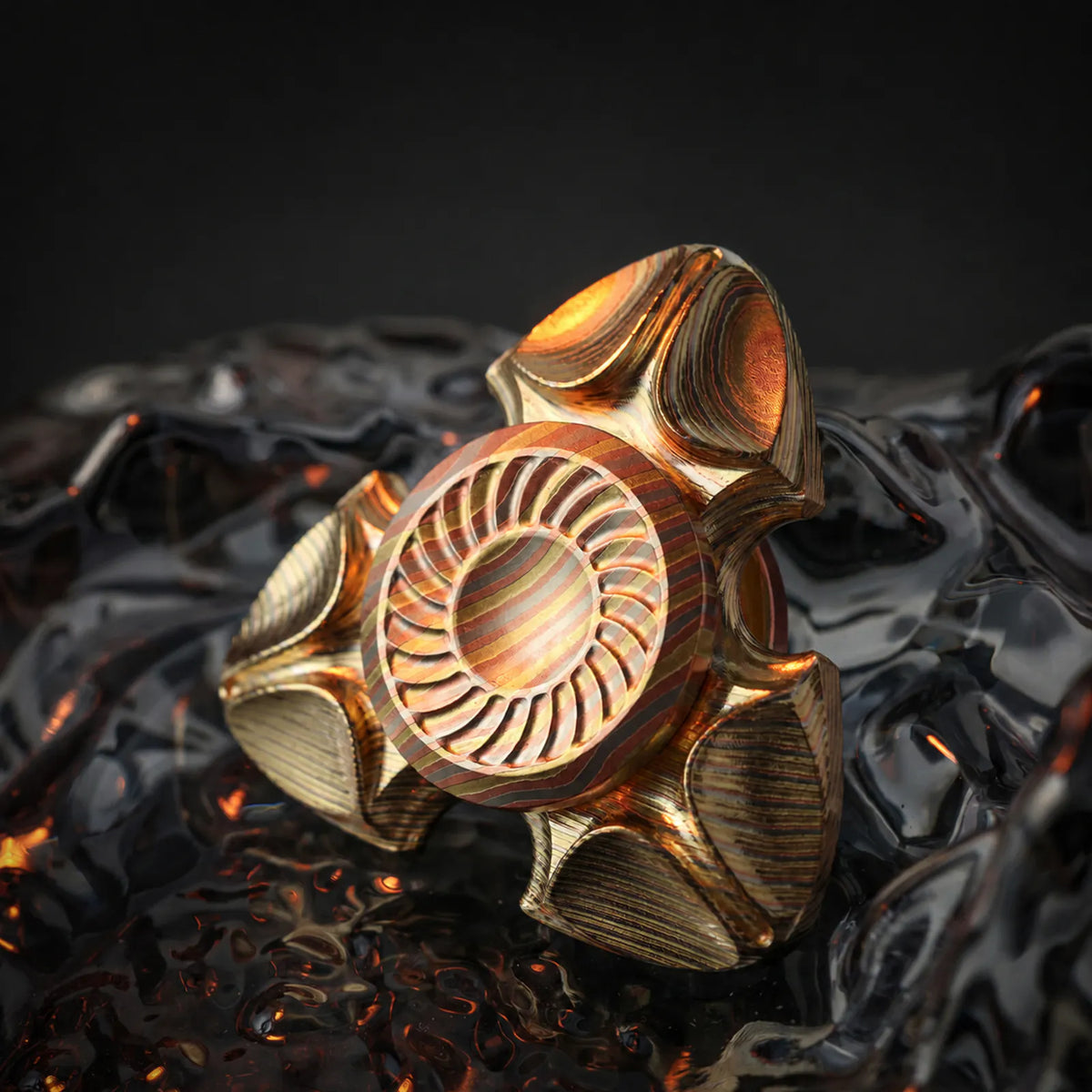 Layered copper Chimago Xumi spinner on a dark sculpted surface