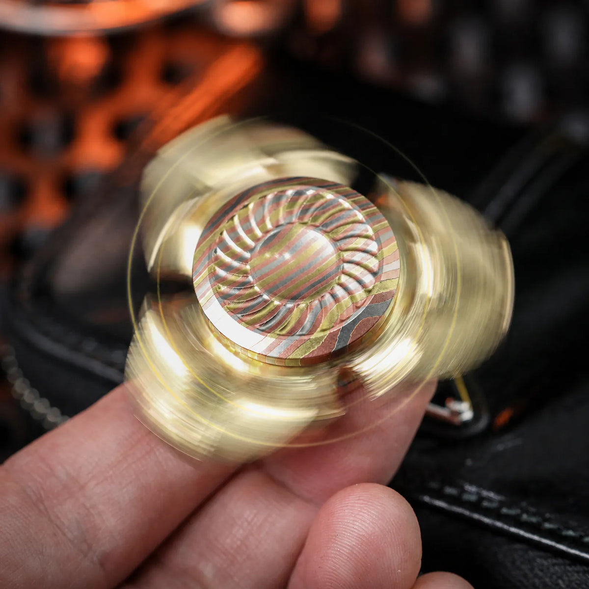 Chimago Xumi fidget spinner rotating between the fingers