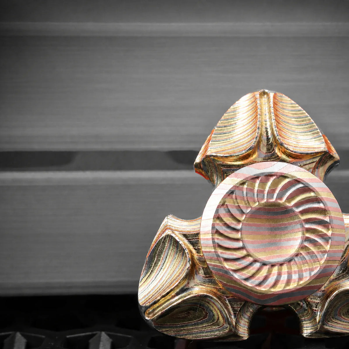 Chimago Xumi metal spinner shown against a clean gray background