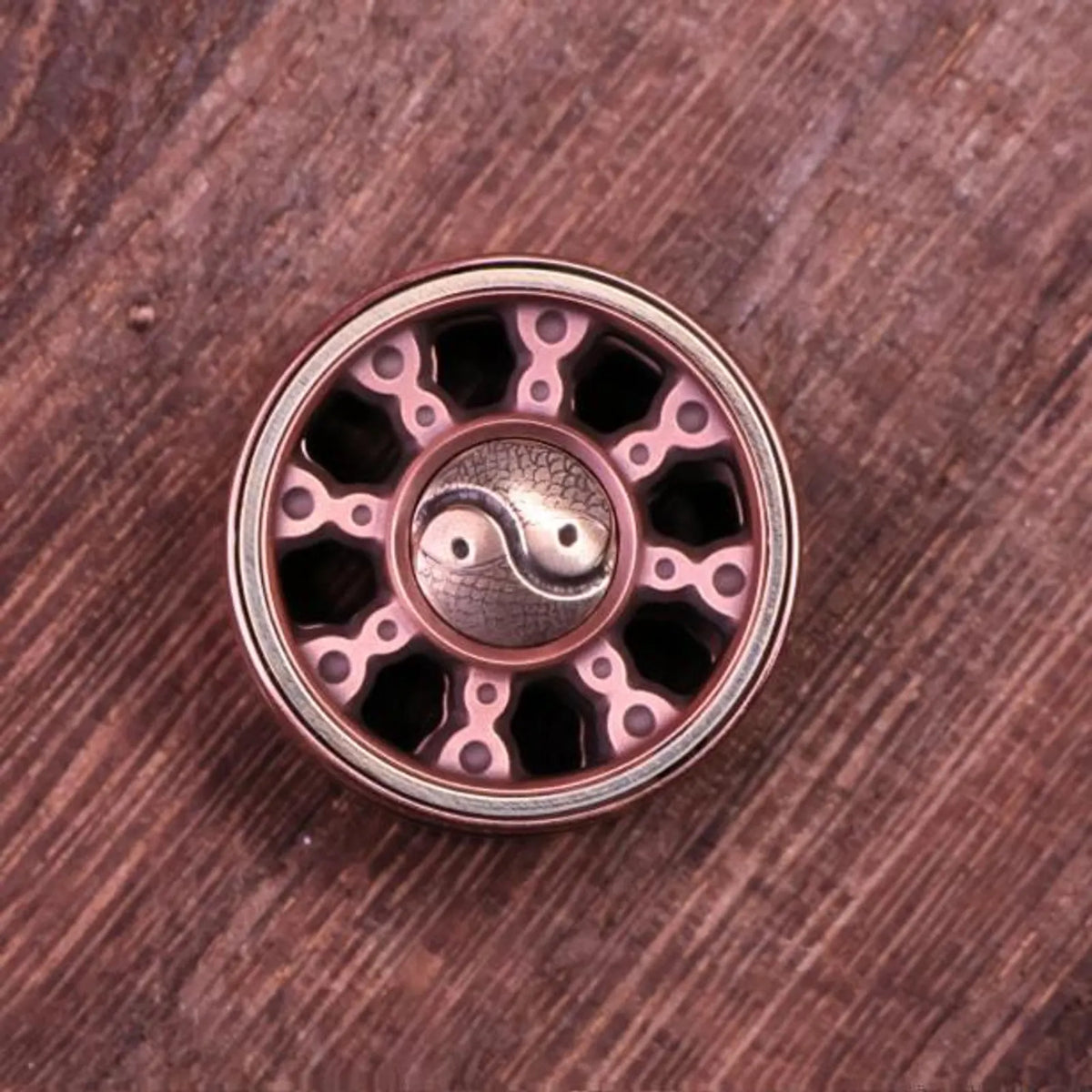 Round metal spinner buttons shown from both sides