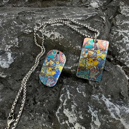 Pokemon Artwork Titanium Dog Tag: two illustrated dog tag body designs with chains (gallery view 02).