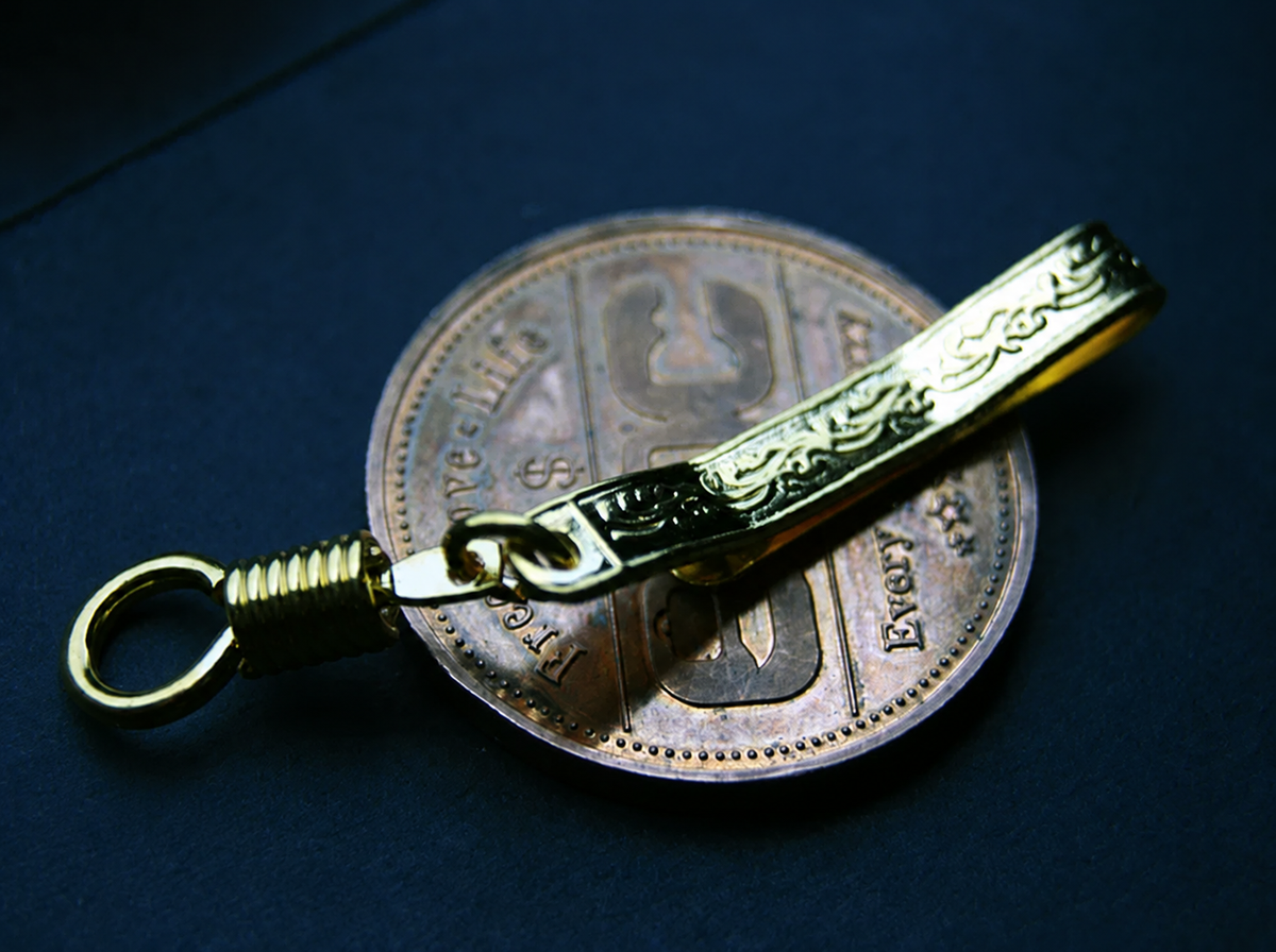 Gold-tone scroll-patterned EDC pocket clip with coiled connector and ring; display coin not included