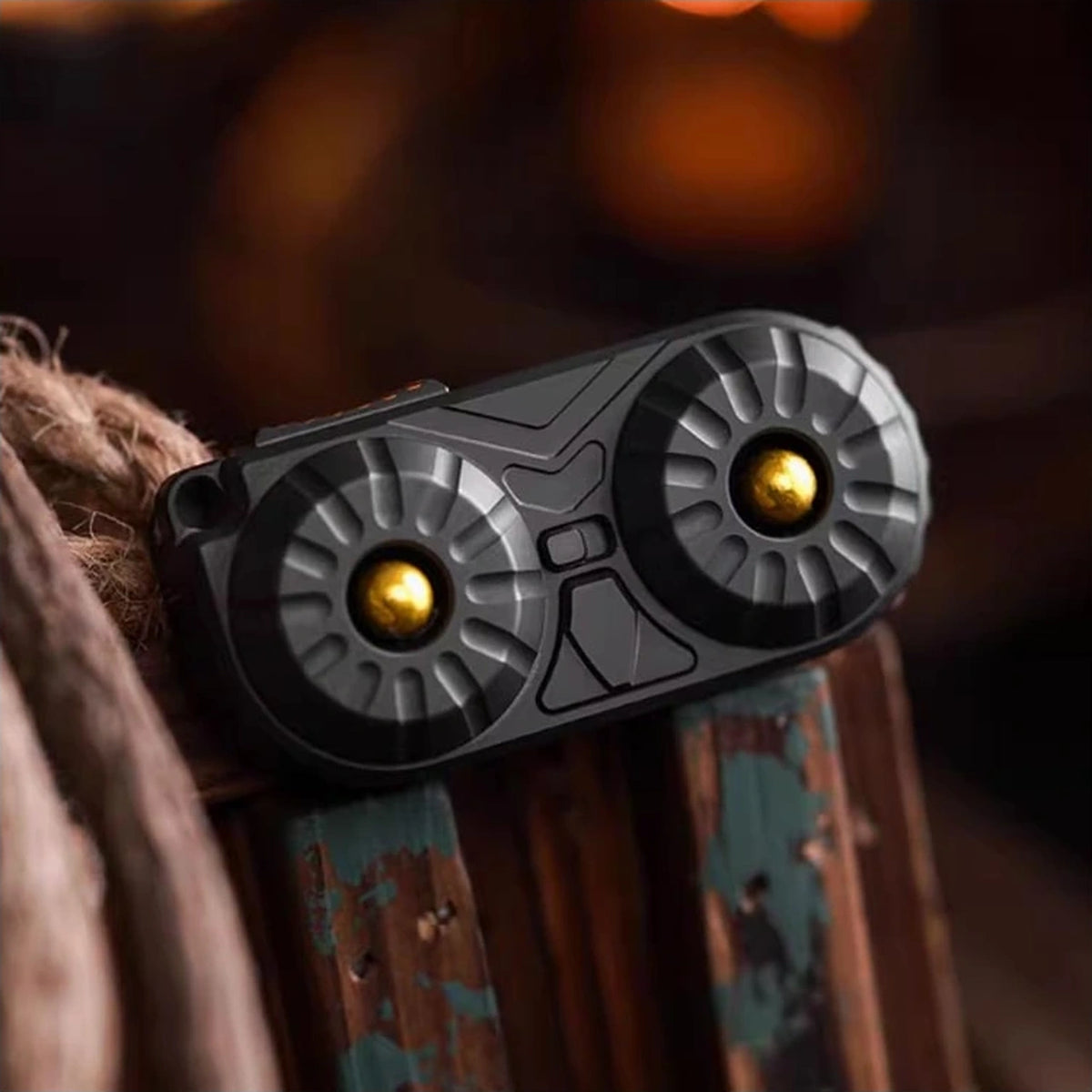 Owl-Face Stainless Steel Fidget Slider: black owl face held in a hand (gallery view 05).