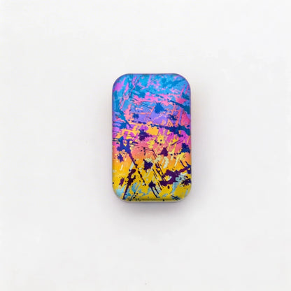 Rotating Titanium Fidget Slider: pink blue and yellow splatter face (gallery view 06).