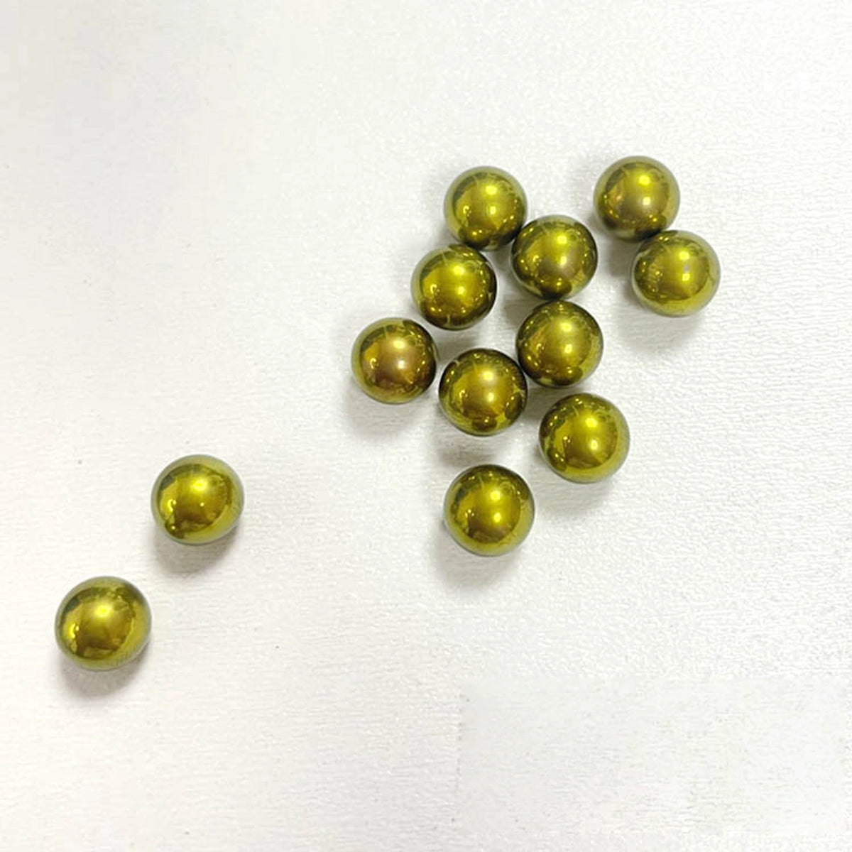 Titanium Spinner Balls: apricot gold plain balls on white (gallery view 08).