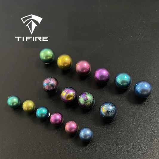 Titanium Spinner Balls: assorted plain and splatter balls against black (gallery view 01).