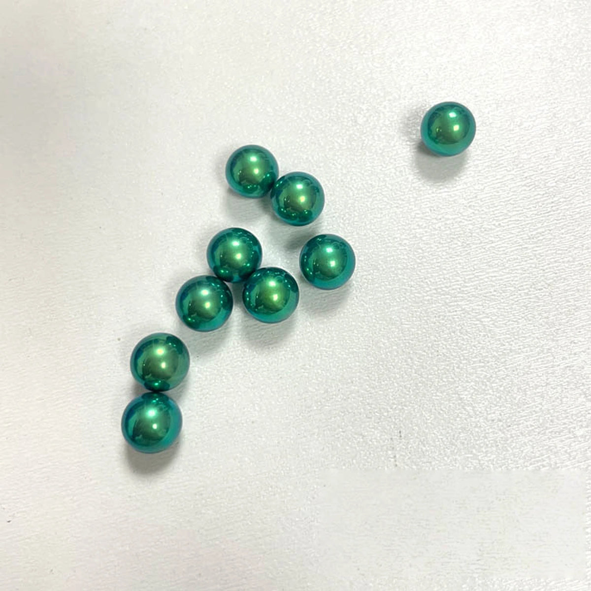 Titanium Spinner Balls: second willow green ball grouping on white (gallery view 17).
