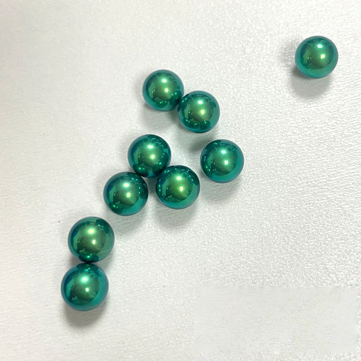 Titanium Spinner Balls: willow green plain balls on white (gallery view 11).