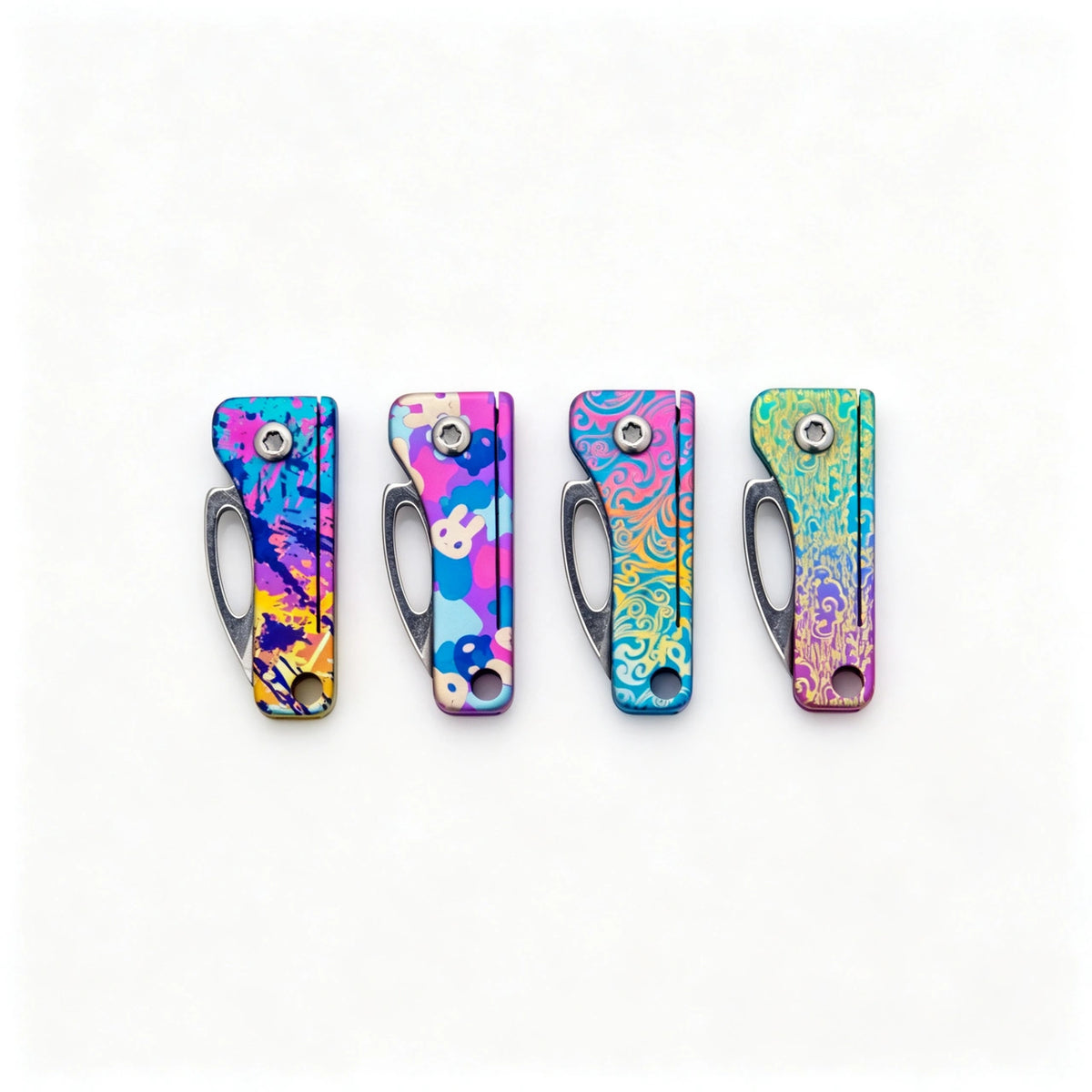 Compact Titanium Folding Keychain Knife: four rectangular illustrated handles folded side by side (gallery view 01).