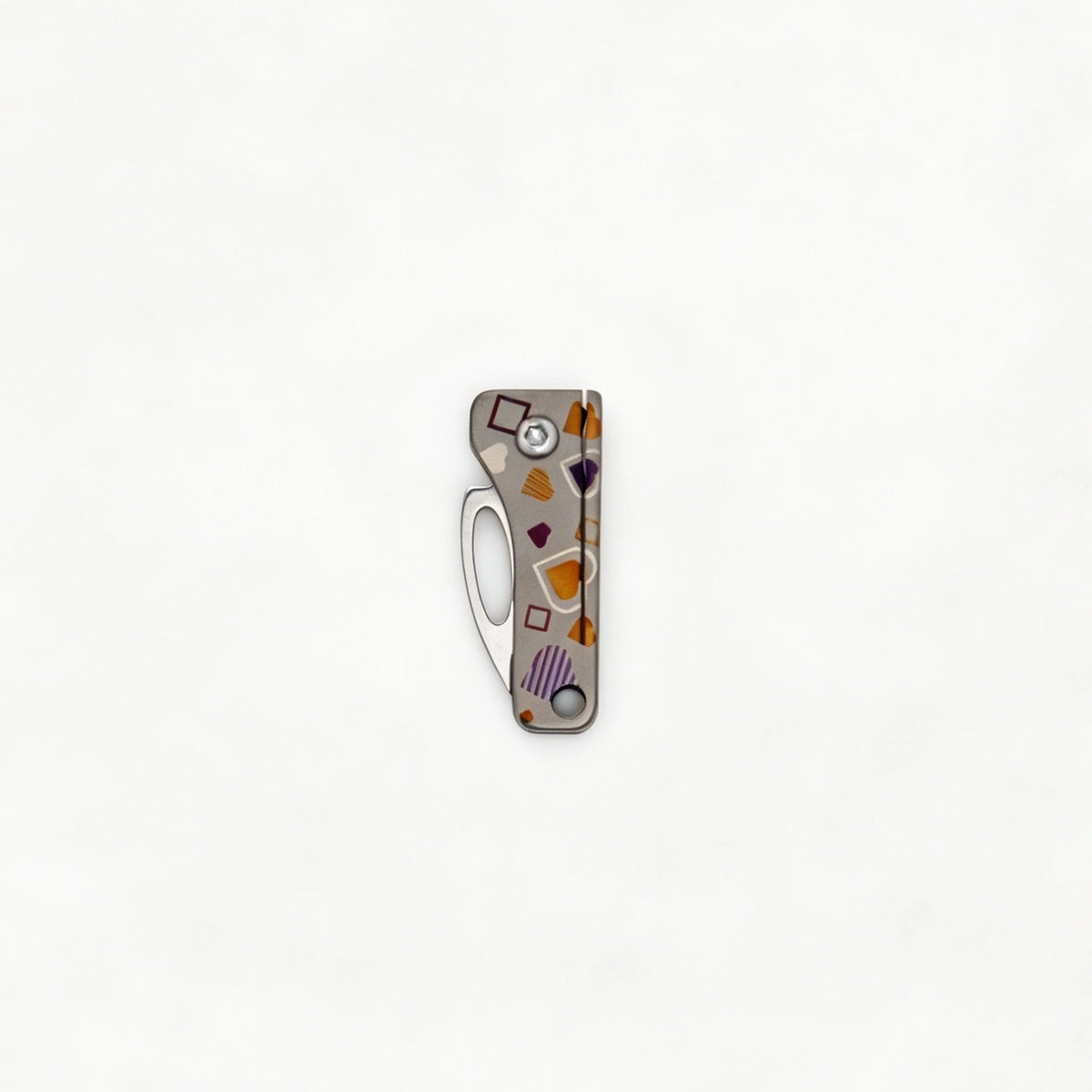 Compact Titanium Folding Keychain Knife: gray heart-pattern handle with blade folded (gallery view 04).