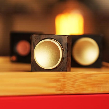 Ebony wood mechanical spinner with brass center button