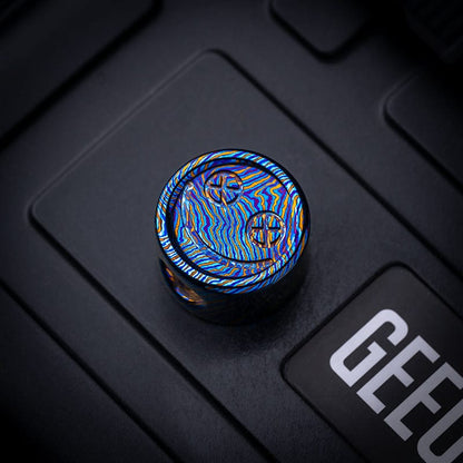EDC Lanyard Bead – Bad Guy Smile | Titanium Zirconium Damascus Mokuti Super Conductor