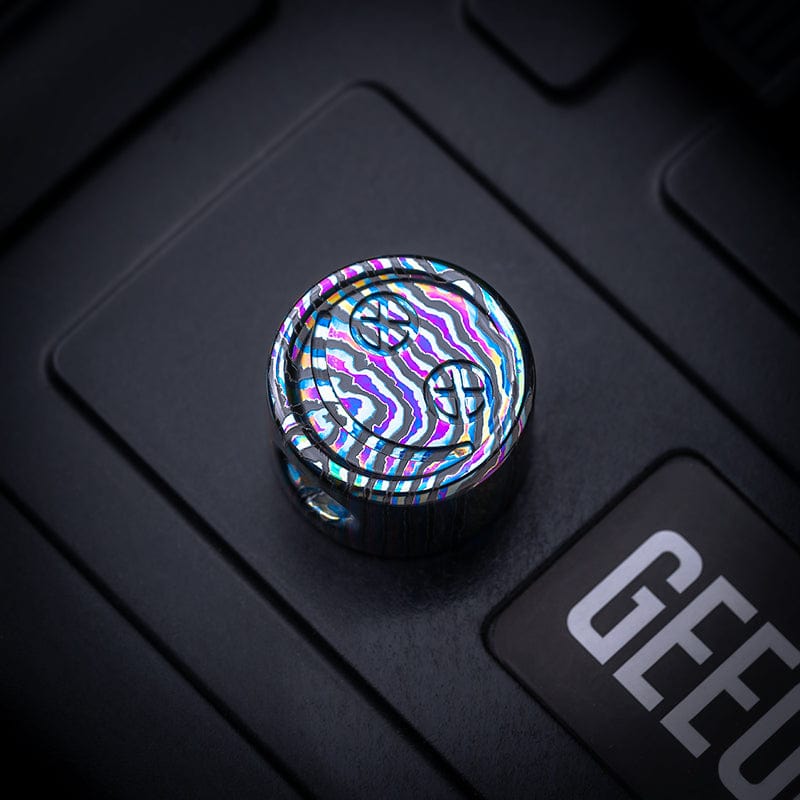 EDC Lanyard Bead – Bad Guy Smile | Titanium Zirconium Damascus Mokuti Super Conductor