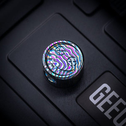 EDC Lanyard Bead – Bad Guy Smile | Titanium Zirconium Damascus Mokuti Super Conductor