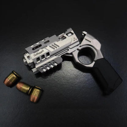 Silver Ring-Frame toy beside two small accessory pieces