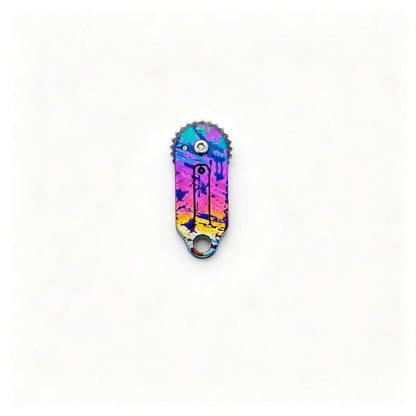 Gear-Edge Titanium Keychain Knife: multicolor illustrated handle folded on white (gallery view 03).