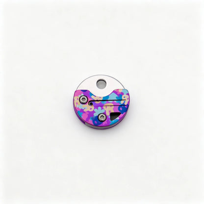 Coin-Shaped Titanium Keychain Knife: round rabbit artwork handle folded on white (gallery view 04).