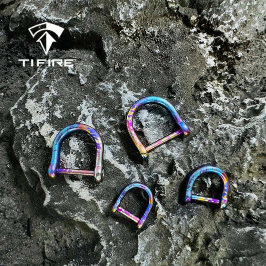 Titanium Horseshoe Keychain Shackle: four horseshoe shackle sizes on stone (gallery view 01).