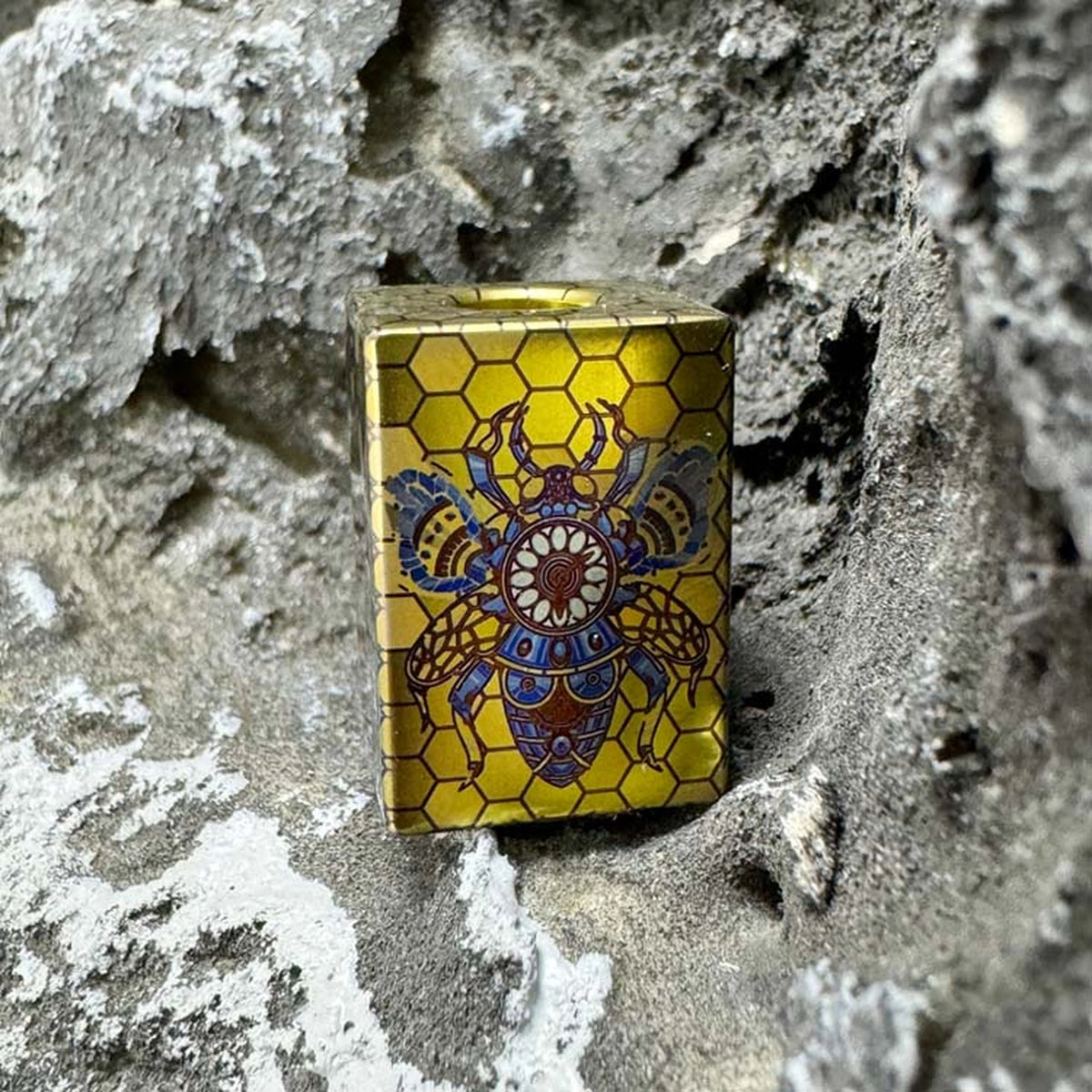 Bee Emperor Titanium Lanyard Bead: angled bee artwork front face (gallery view 05).