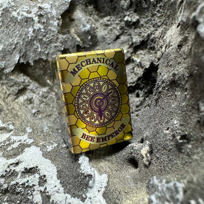Bee Emperor Titanium Lanyard Bead: angled circular emblem side face (gallery view 04).