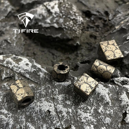 Dark Skull Titanium Lanyard Beads: assorted loose skull bead shapes on stone (gallery view 03).