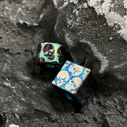Green & Blue Skull Titanium Lanyard Beads: green and blue loose skull beads on stone (gallery view 03).