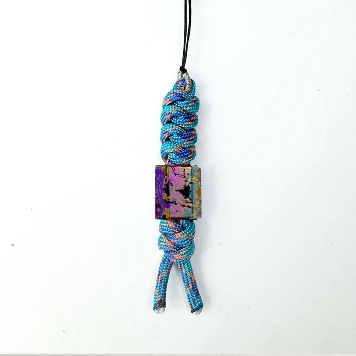 Classic Splatter Titanium Lanyard Beads: hexagonal bead on pale blue cord (gallery view 13).