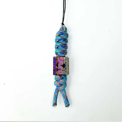 Classic Splatter Titanium Lanyard Beads: hexagonal bead on pale blue cord (gallery view 13).