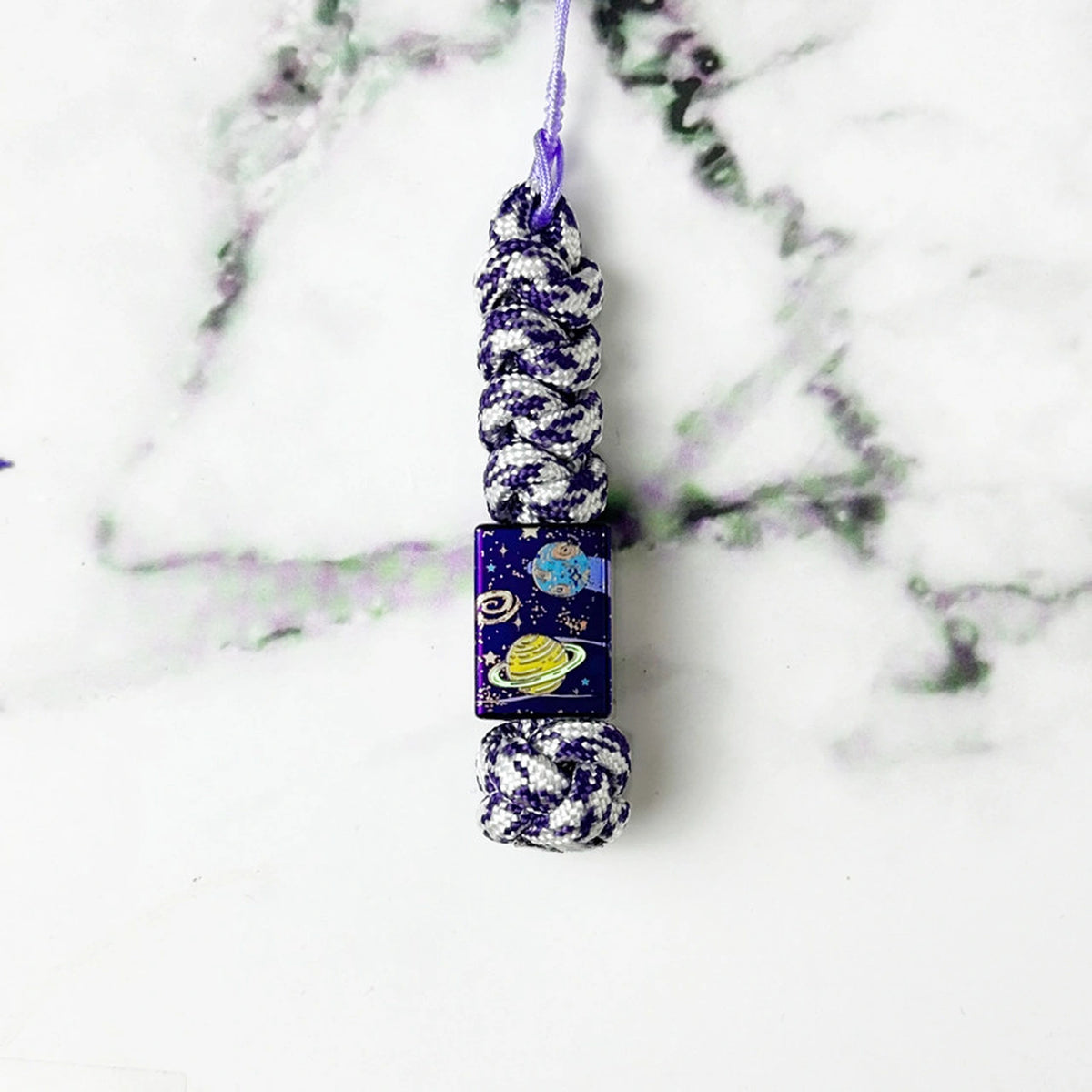 Planet Artwork Titanium Lanyard Beads: large square bead on purple patterned cord (gallery view 13).