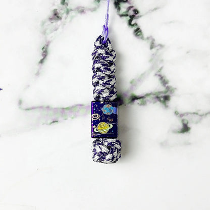 Planet Artwork Titanium Lanyard Beads: large square bead on purple patterned cord (gallery view 13).