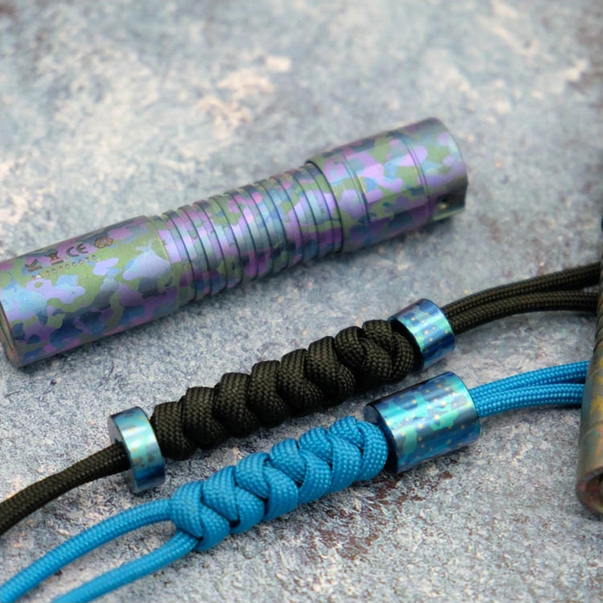 Starry Sky Titanium Lanyard Bead: round beads fitted to black and blue cords (gallery view 03).