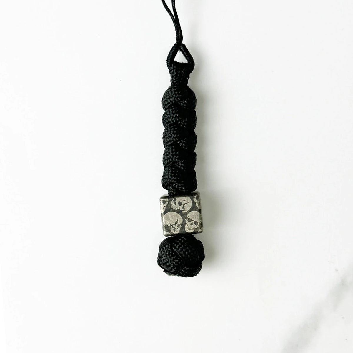 Dark Skull Titanium Lanyard Beads: round skull bead on plain black cord (gallery view 12).