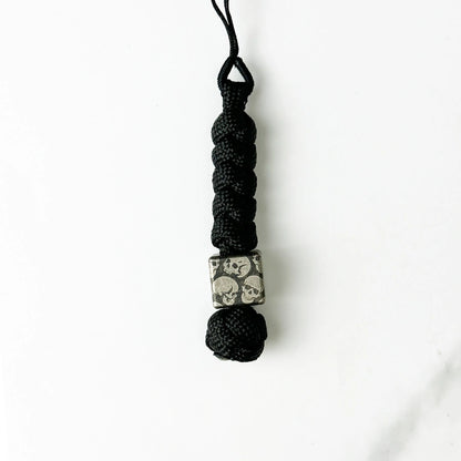 Dark Skull Titanium Lanyard Beads: round skull bead on plain black cord (gallery view 12).