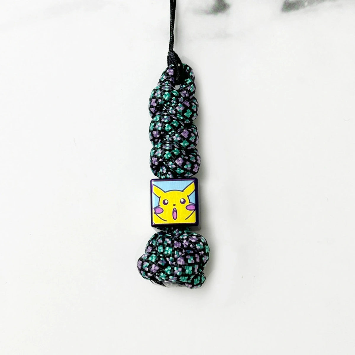 Pikachu Artwork Titanium Lanyard Beads: small character bead on dark patterned cord (gallery view 07).