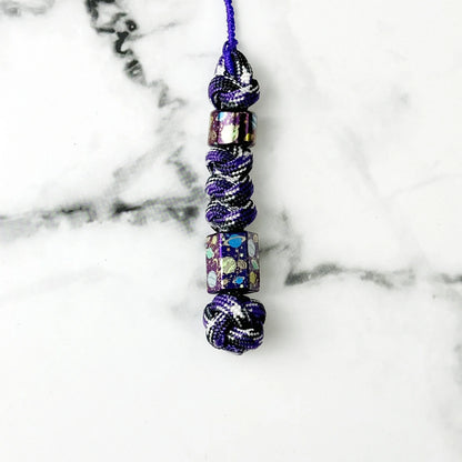 Planet Artwork Titanium Lanyard Beads: small round and hexagonal beads on purple cord (gallery view 16).