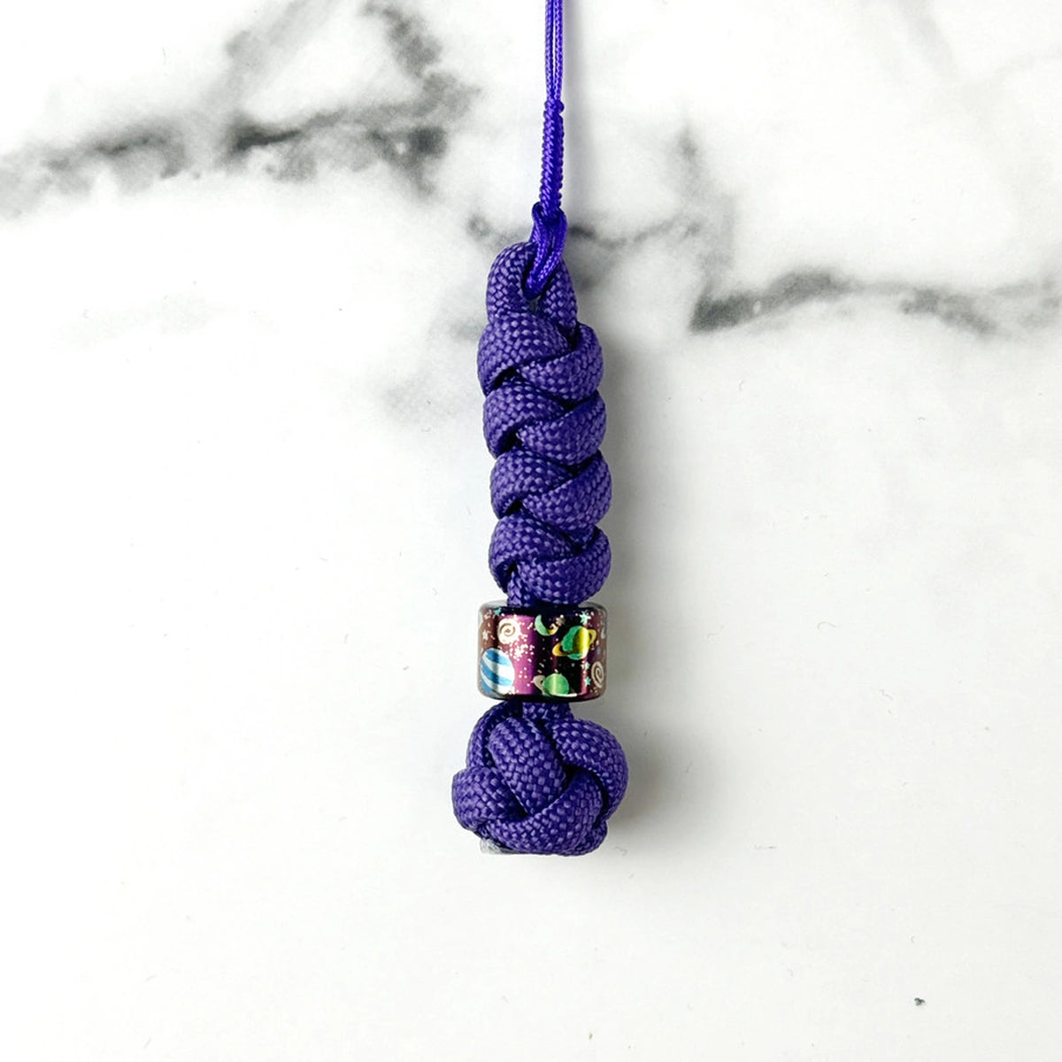 Planet Artwork Titanium Lanyard Beads: small round bead on plain purple cord (gallery view 10).