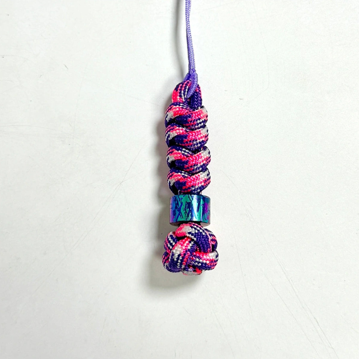 Classic Splatter Titanium Lanyard Beads: small square and hexagonal beads on pink cord (gallery view 16).