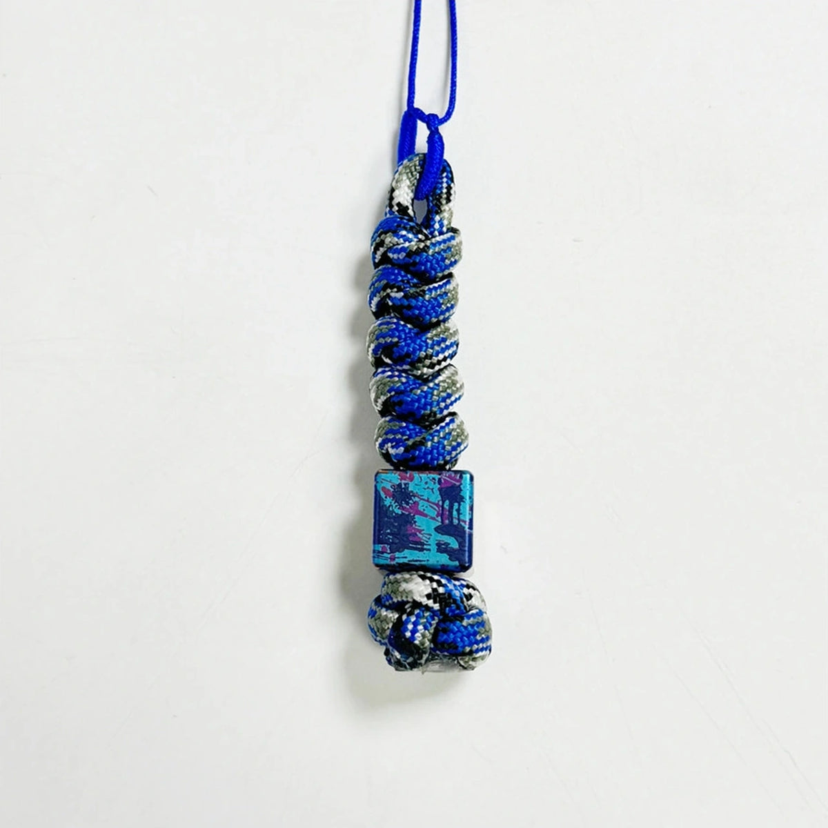 Classic Splatter Titanium Lanyard Beads: small square bead on blue purple cord (gallery view 11).