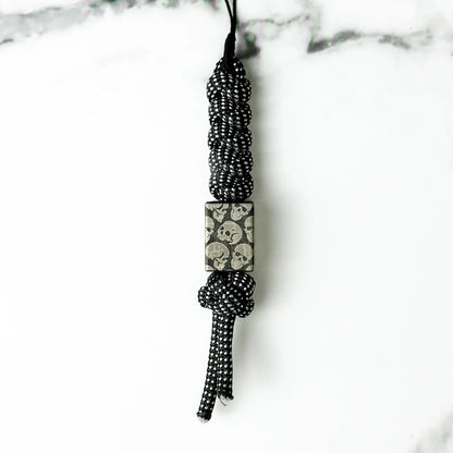 Dark Skull Titanium Lanyard Beads: small square skull bead on black patterned cord (gallery view 13).