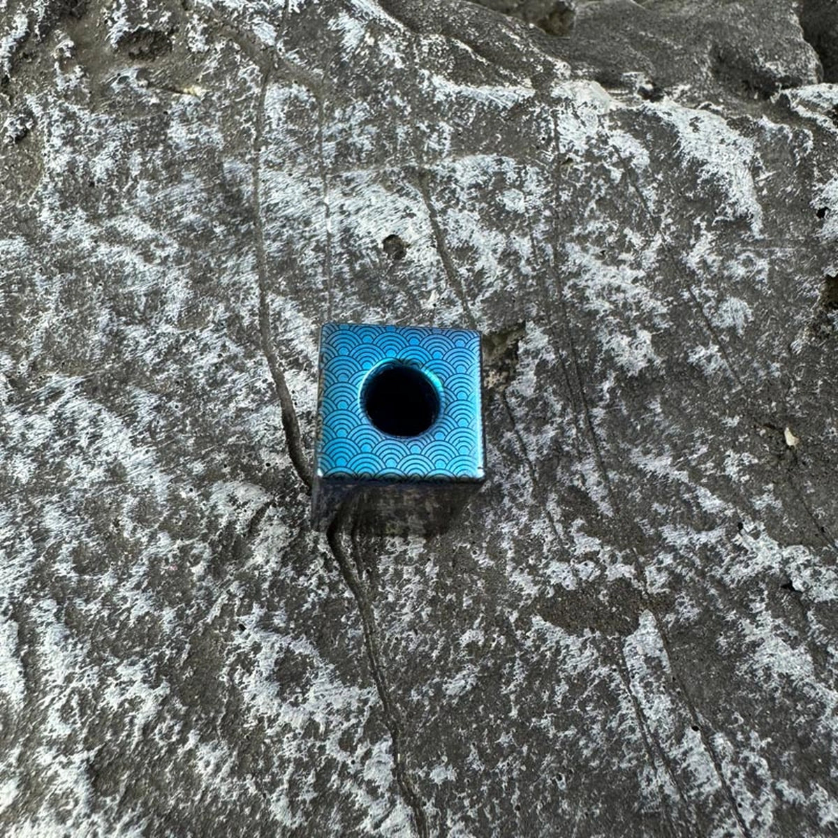 Wave Dragon Titanium Lanyard Bead: top view showing blue center opening (gallery view 03).
