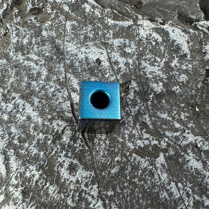 Wave Dragon Titanium Lanyard Bead: top view showing blue center opening (gallery view 03).
